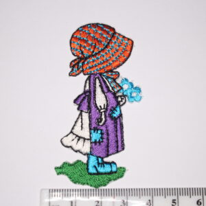 Girl with purple dress holding a bunch of flowers Girl with purple dress holding a bunch of flowers