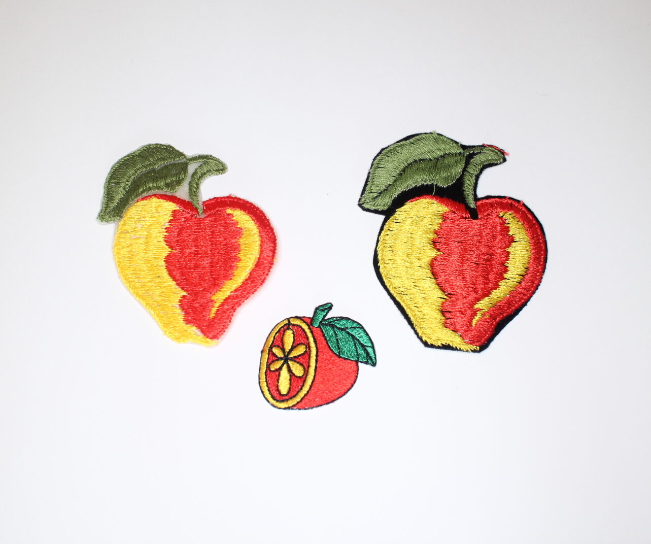 Photo of an apple and tomato iron on patch