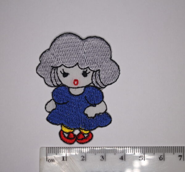Lady wearing blues dress patch
